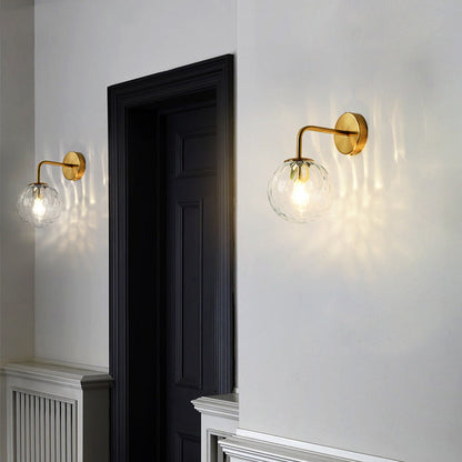 Contemporary Textured Globe Wall Light with Brass Arm | Single-Bulb Sconce for Bedroom, Hallway & Living Room | Hardwired Electric Fixture