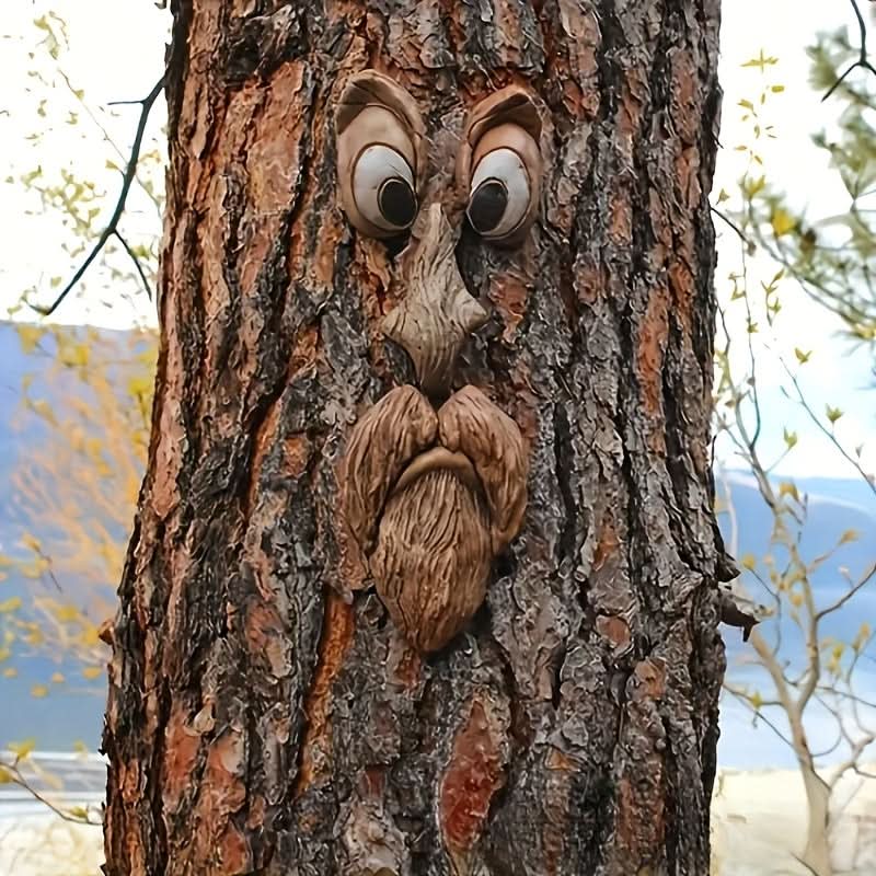 WOODWINK - Whimsical tree face ornament crafted to bring playful character outdoors.