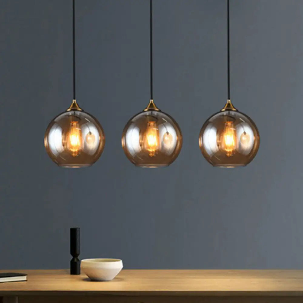 Three-Light Hanging Ceiling Fixture with Tapered Glass Globes in Antique Brass Finish for Dining Room Kitchen Island
