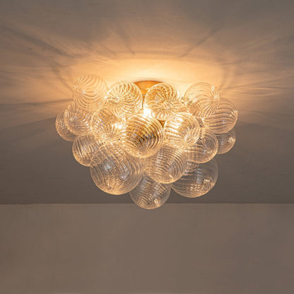 Three-Globe Ceiling Mount Fixture with Textured Glass Shades in Warm Metal Finish for Entry, Dining Room & Living Room