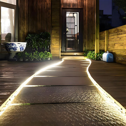 Solar-Powered Flexible Pathway Light Strip 16.4 ft Warm Glow Waterproof Deck Stair Accent Lighting for Patios Driveways Garden Borders Pergo